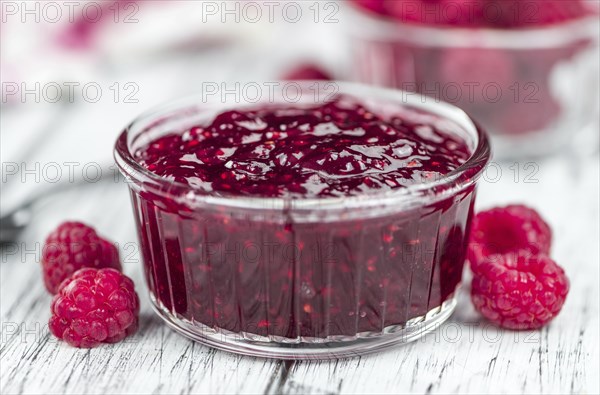 Some homemade Raspberry Jam as detailed close-up shot, selective focus