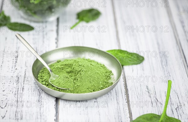 Freshly made green spinach powder (detailed close up shot, selective focus)