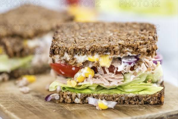 Tuna Sandwich (wholemeal bread, selective focus) on an old wooden table