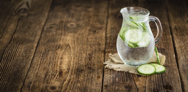 Cucumber Water on a vintage background as detailed close-up shot, selective focus