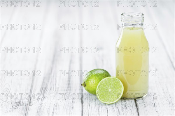 Portion of fresh Lime Juice (close-up shot, selective focus)