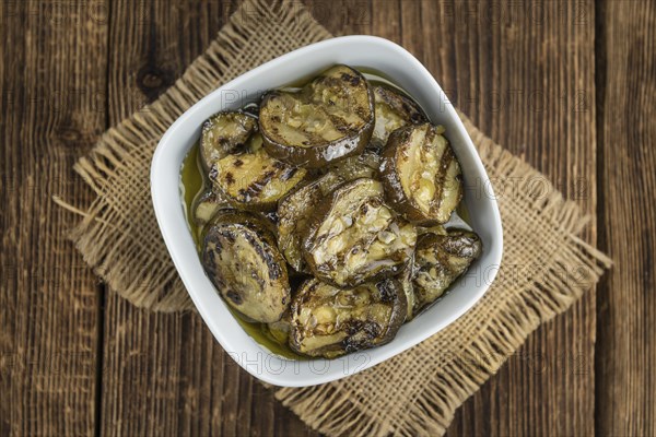 Homemade Antipasti (Grilled Zucchinis) on vintage background (selective focus, close-up shot)
