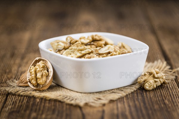 Portion of fresh Walnut kernels (close-up shot, selective focus)