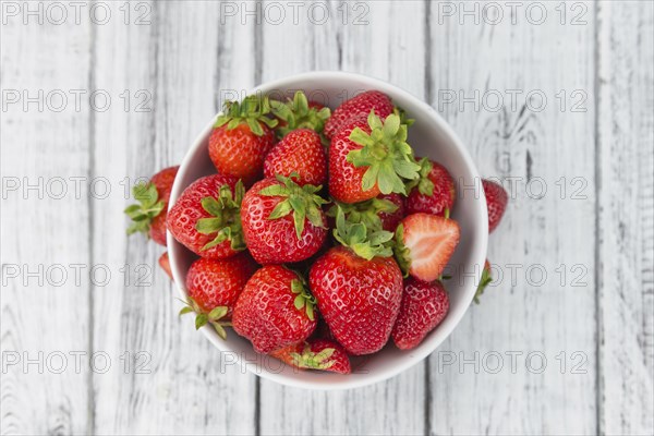 Strawberries on a vintage background as detailed close-up shot, selective focus