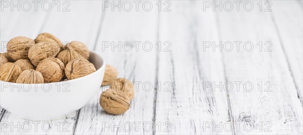 Walnuts on a vintage background as detailed close-up shot (selective focus)
