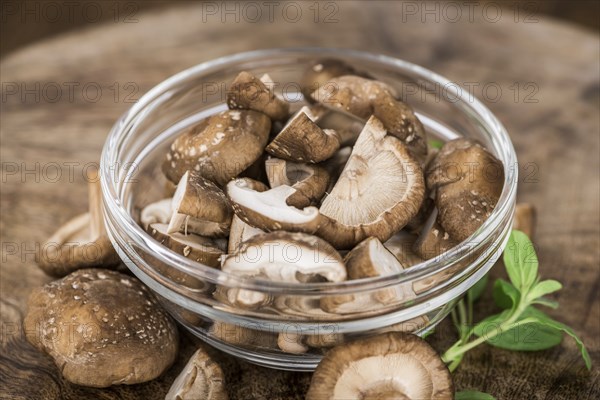 Portion of fresh Shiitake mushrooms close-up shot, selective focus