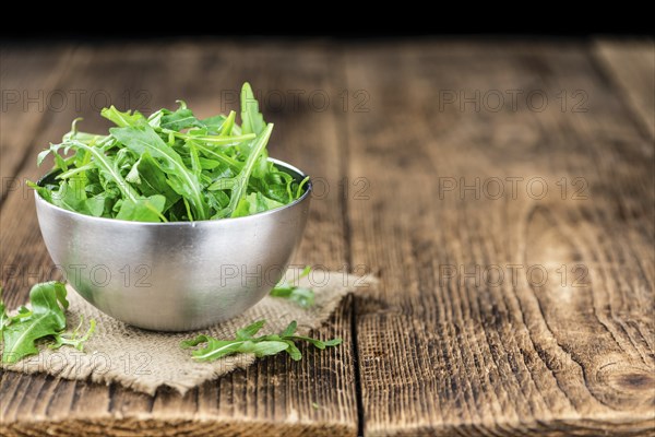 Portion of fresh Arugula (detailed close-up shot, selective focus)