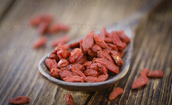 Goji Berries on a vintage background as detailed close-up shot (selective focus)