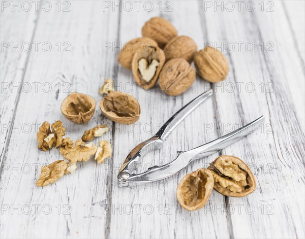 Walnuts on a vintage background as detailed close-up shot (selective focus)