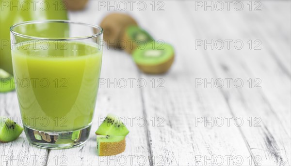 Fresh made Kiwi Smoothie (selective focus) on a vintage looking background