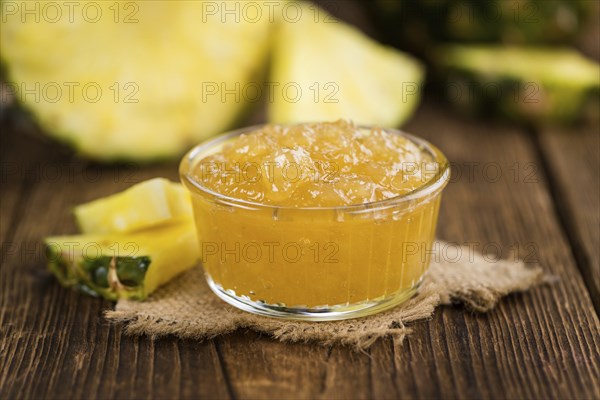 Fresh made Pineapple Jam on a vintage background as detailed close-up shot