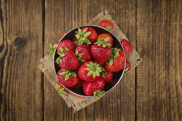 Strawberries on a vintage background as detailed close-up shot, selective focus