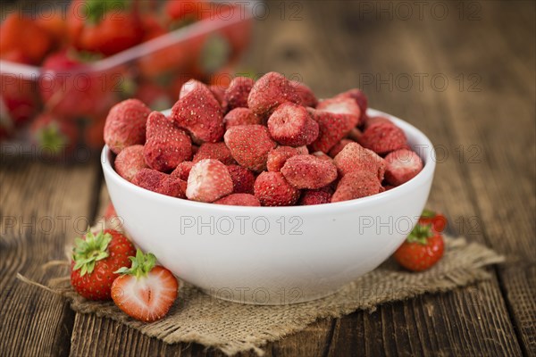 Dried Strawberries on a vintage background as detailed close-up shot, selective focus