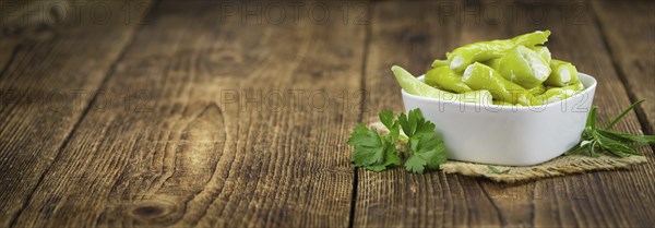 Some homemade Green Chilis (filled with cheese) (selective focus) as detailed close-up shot