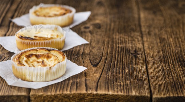 Homemade Cheesecake on an wooden table (selective focus) as detailed close-up shot