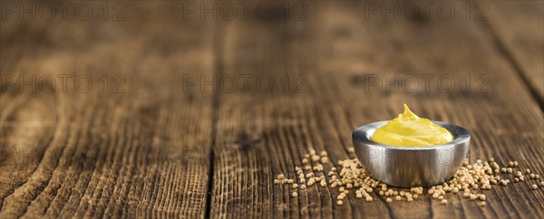 Mustard on a vintage background as detailed close-up shot (selective focus)