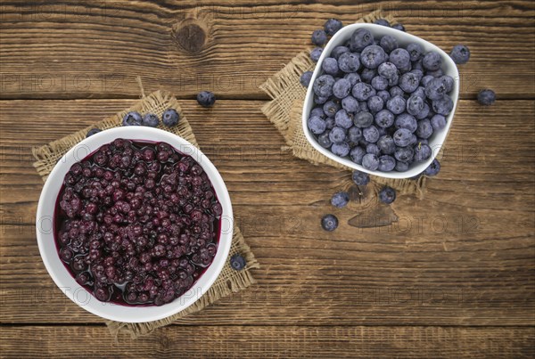 Preserved Blueberries on a vintage background as detailed close-up shot, selective focus