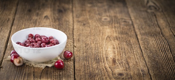 Preserved Cherries on a vintage background as detailed close-up shot, selective focus