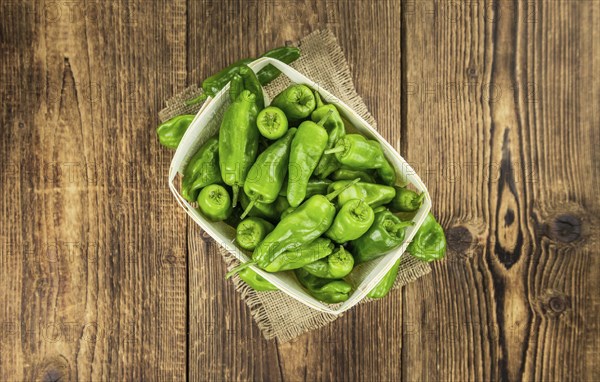 Raw Pimientos on a vintage background as detailed close-up shot, selective focus