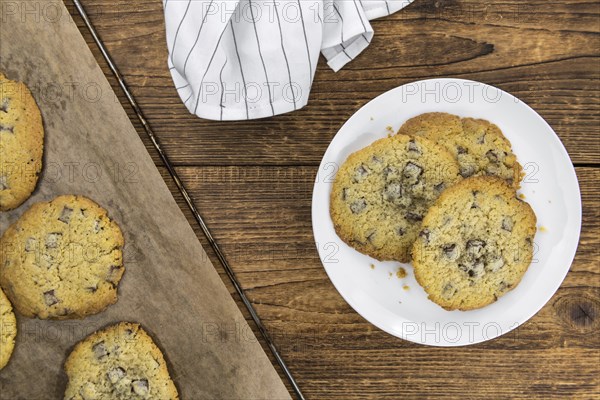 Chocolate Chip Cookies on an old wooden table (selective focus)