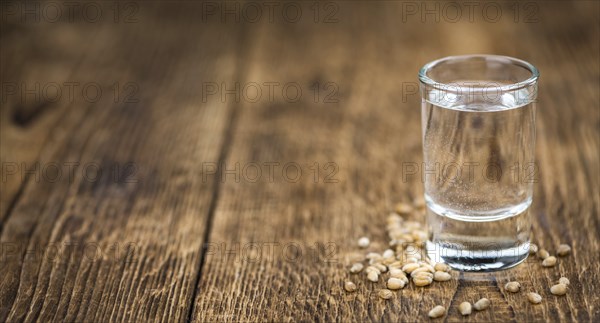 Portion of Wheat Liqueur as detailed close-up shot, selective focus