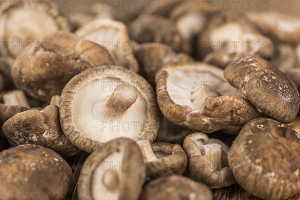 Portion of fresh Shiitake mushrooms close-up shot, selective focus