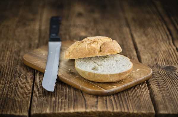 Rolls (German style) on rustic wooden background as close-up shot