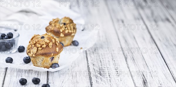 Fresh Blueberry Muffins as detailed close-up shot (selective focus)