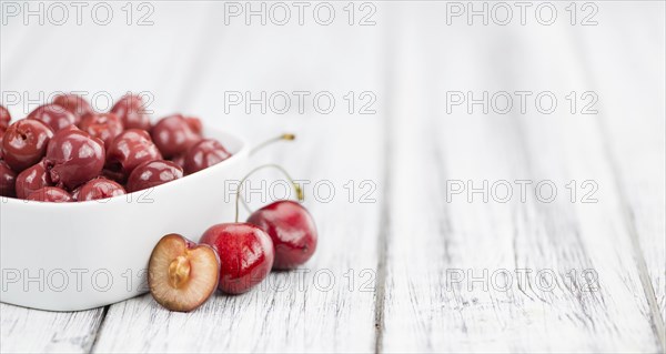 Fresh made Canned Cherries on a vintage background as detailed close-up shot