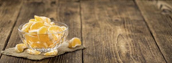 Fresh Tangerine pieces (selective focus) on a vintage background