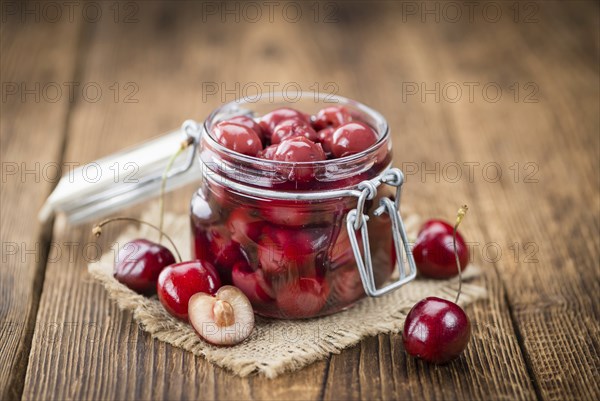 Preserved Cherries on a vintage background as detailed close-up shot, selective focus