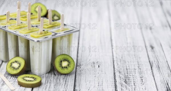 Kiwi Popsicles (fresh) as detailed close-up shot, selective focus)