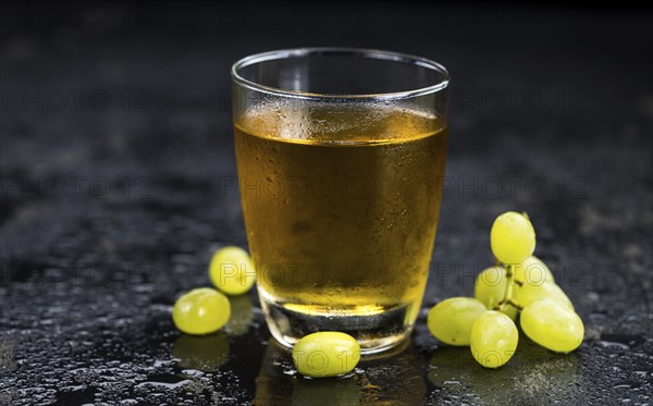 Some healthy Grape Juice (selective focus, close-up shot)