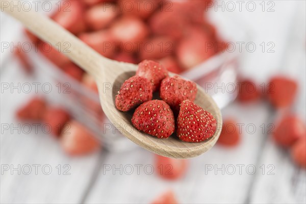 Dried Strawberries on a vintage background as detailed close-up shot, selective focus