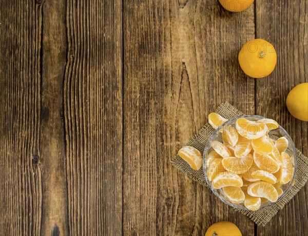 Portion of tangerines (close-up shot) on a vintage background (selective focus)