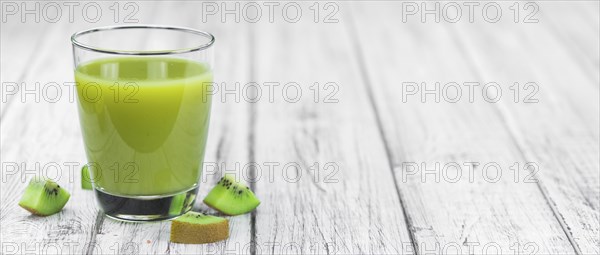 Fresh made Kiwi Smoothie (selective focus) on a vintage looking background