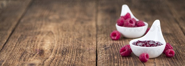 Fresh made Raspberry Jam on a vintage background as detailed close-up shot