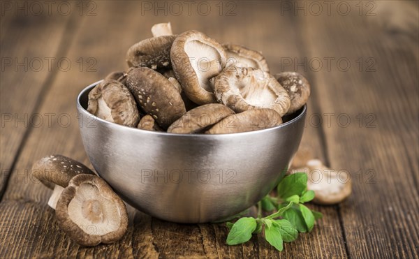 Portion of fresh Shiitake mushrooms close-up shot, selective focus