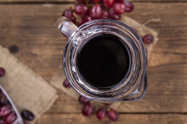 Some fresh Red Grape Juice (selective focus, close-up shot)