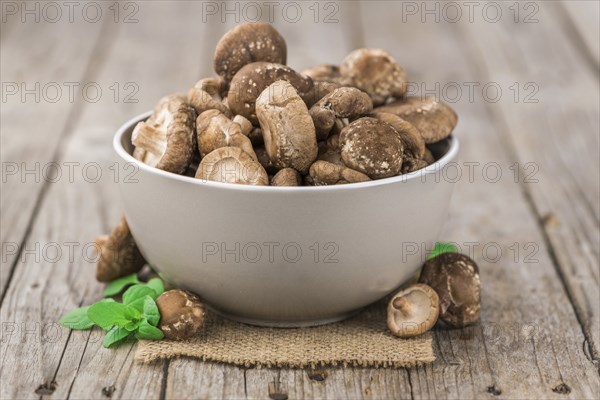 Portion of fresh Shiitake mushrooms close-up shot, selective focus