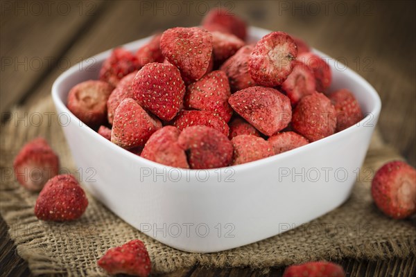 Dried Strawberries on a vintage background as detailed close-up shot, selective focus