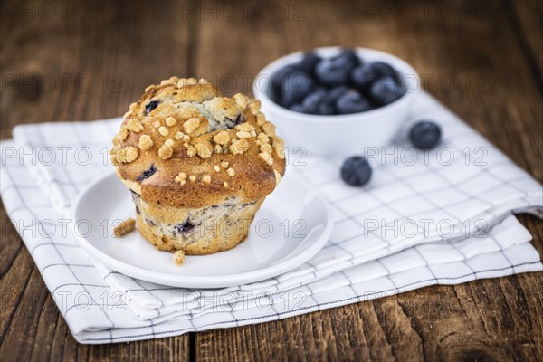 Fresh Blueberry Muffins as detailed close-up shot (selective focus)