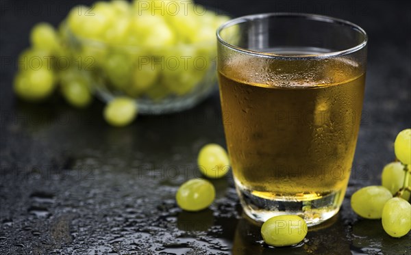 Some healthy Grape Juice (selective focus, close-up shot)