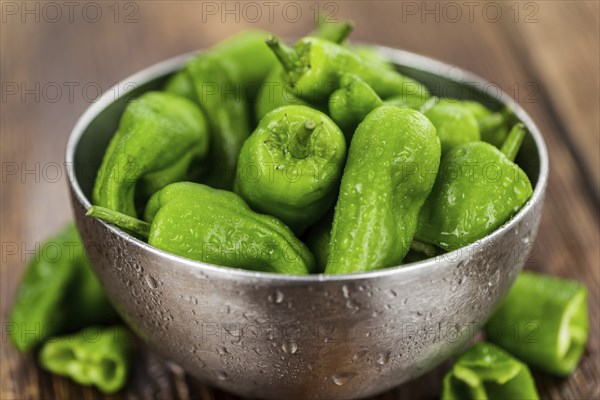 Raw Pimientos on a vintage background as detailed close-up shot, selective focus