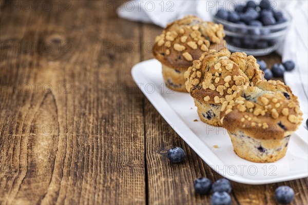 Some fresh Blueberry Muffins (selective focus, close-up shot)
