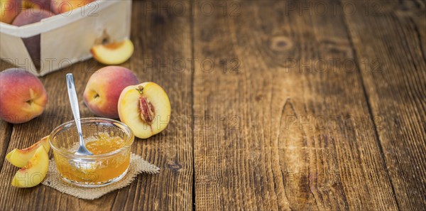 Peach Jam on a vintage background as detailed close-up shot, selective focus