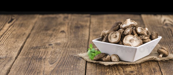 Portion of fresh Shiitake mushrooms close-up shot, selective focus
