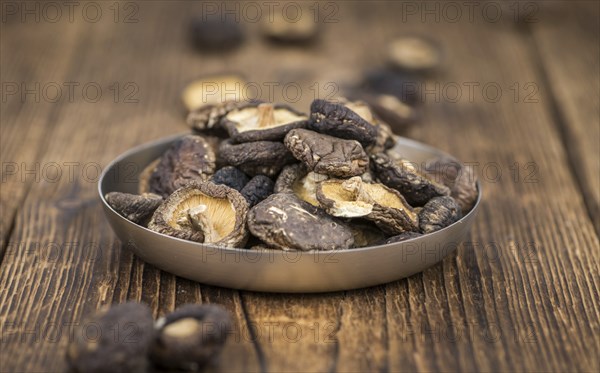 Homemade Dried Shiitake on an wooden table as detailed close-up shot, selective focus