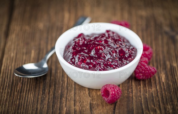 Some homemade Raspberry Jam as detailed close-up shot, selective focus