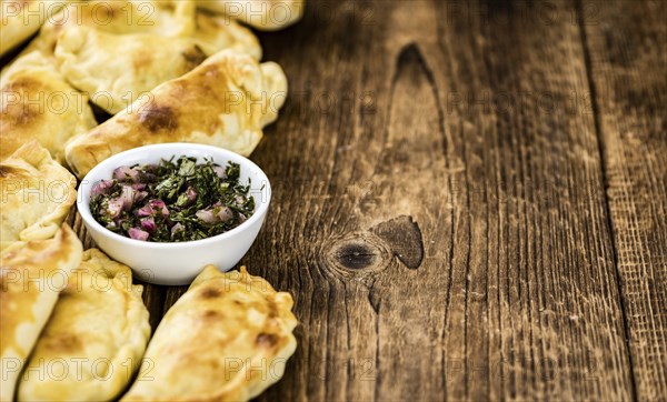Portion of fresh homemade Empanadas as detailed close-up shot, selective focus